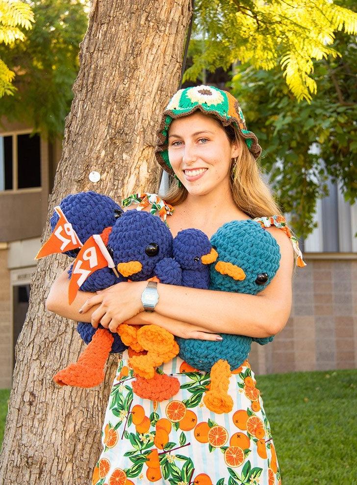 lucy conover holds crocheted cecil the sagehens